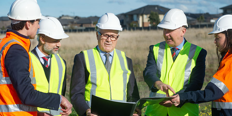 Principal Sweeney reviewing construction